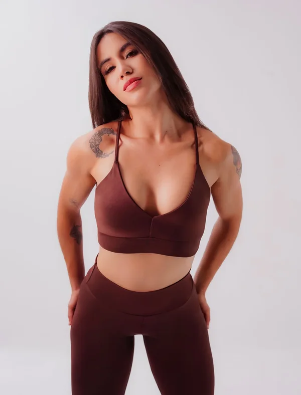 Maroon activewear set on a model after colour and skin retouching